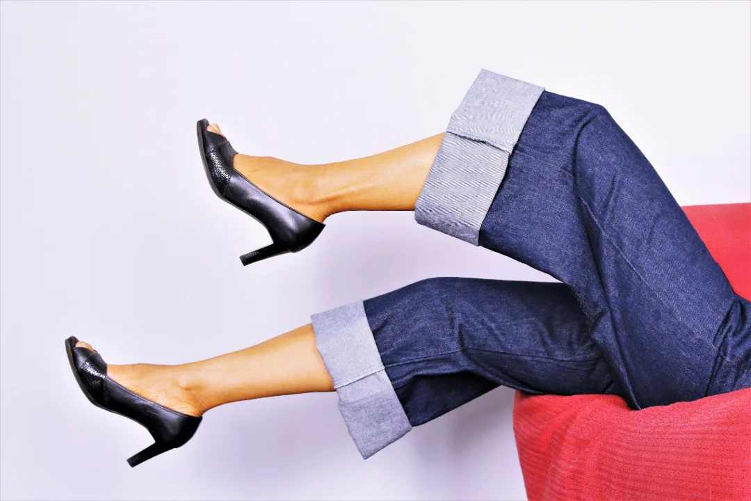 Women laying on couch with black heels